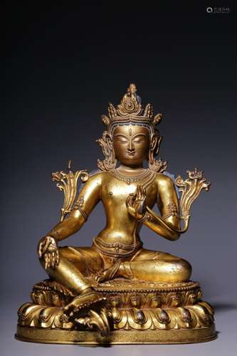 A gilt-bronze green Tara seated figure, Qing Dynasty