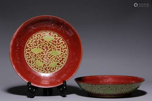 Pair of red and green colored floral pattern plates