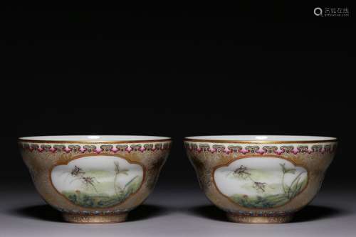 A pair of folded waist cups with gold-painted flowers, windo...