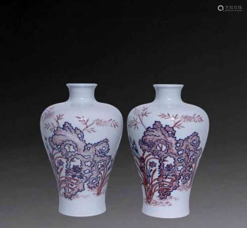 A pair of blue and white alum red plum vases