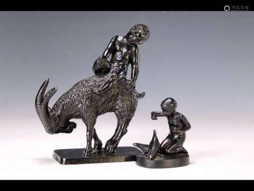 Two sculptures, cast iron, around 1920, 1 boy on a billy