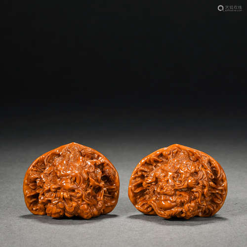 A pair of carved arhat walnuts