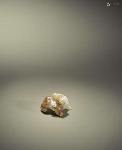 A SMALL WHITE AND RUSSET JADE CARVING OF A BIXIE Song Dynast...