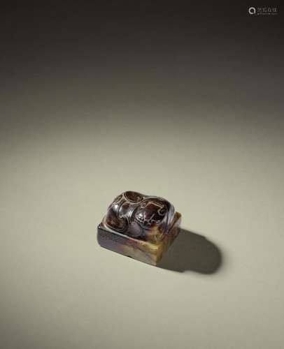 AN INSCRIBED BROWN JADE 'MYTHICAL BEAST' SEAL Yuan D...