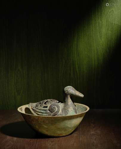 A RARE ARCHAIC BRONZE 'DUCK' INCENSE BURNER AND COVE...