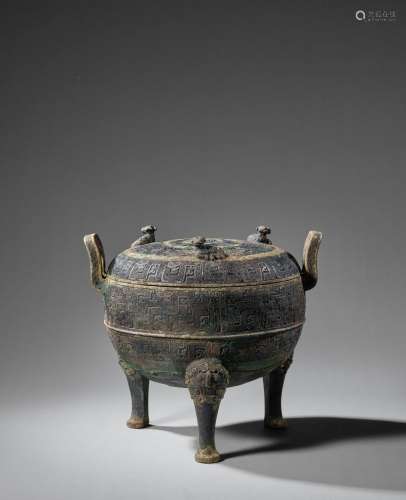 AN ARCHAIC BRONZE RITUAL VESSEL AND COVER, DING Eastern Zhou...