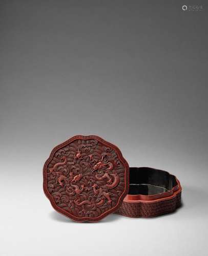 A CARVED CINNABAR LACQUER 'DRAGON' BOX AND COVER 18t...