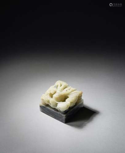 A RARE WHITE AND GREY JADE 'DRAGON' SEAL Qianlong/Ji...