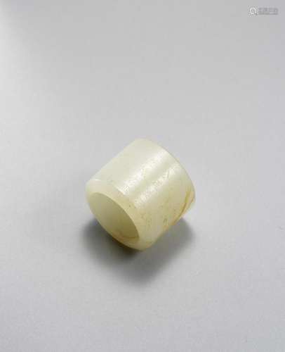 A FINE IMPERIAL INSCRIBED WHITE JADE THUMB RING Qianlong