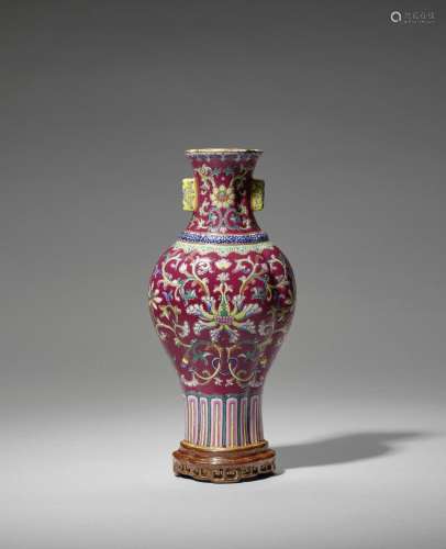 A RUBY-RED GROUND FAMILLE ROSE WALL VASE Gilt Qianlong seal ...