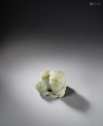 A PALE GREEN JADE 'BUDDHIST LION AND CUB' CARVING 18...