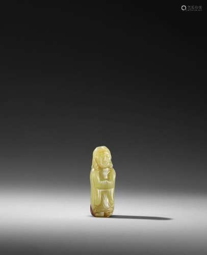 A YELLOW AND RUSSET JADE FIGURE OF A FOREIGNER Song/Yuan dyn...
