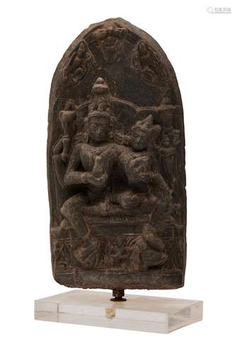 AN INDIAN BLACK STONE RELIEF CARVING OF VISHNU AND LAKSHMI