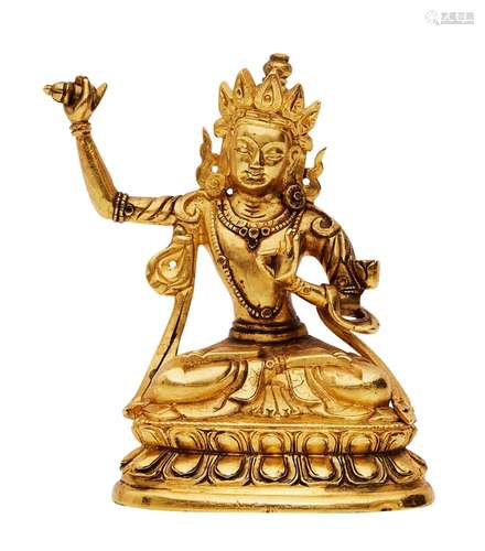 A TIBETAN GILT-BRONZE FIGURE OF MANJUSHRI