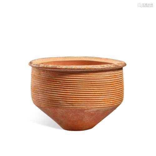 A deep pottery bowl with horizontal grooves, Dawenkou to Lon...