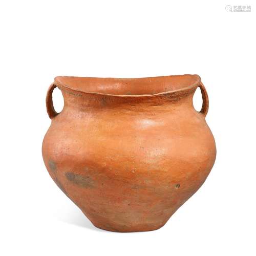 A large red pottery 'saddle-mouth' handled jar, Siwa...