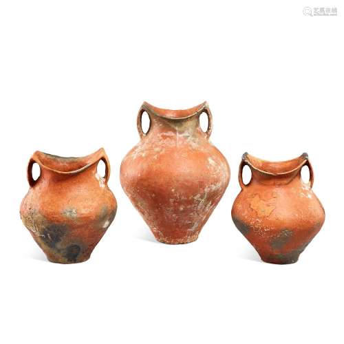 Three red pottery 'saddle-mouth' handled jars, Siwa ...