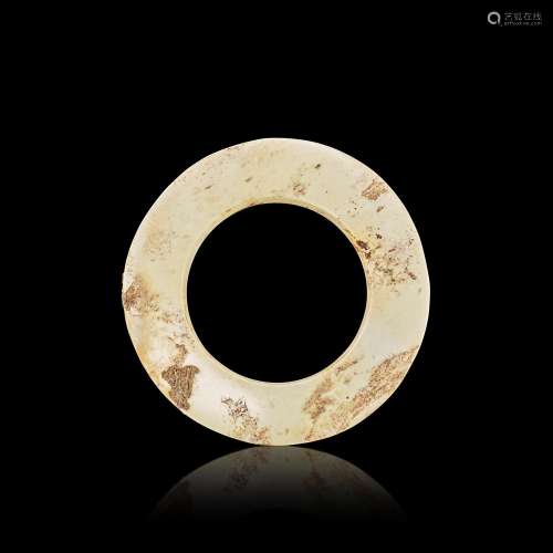 An archaic calcified jade ring, yuan, Neolithic period, Lian...
