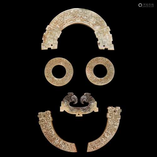 A group of six archaic jade ornaments, Eastern Zhou dynasty,...