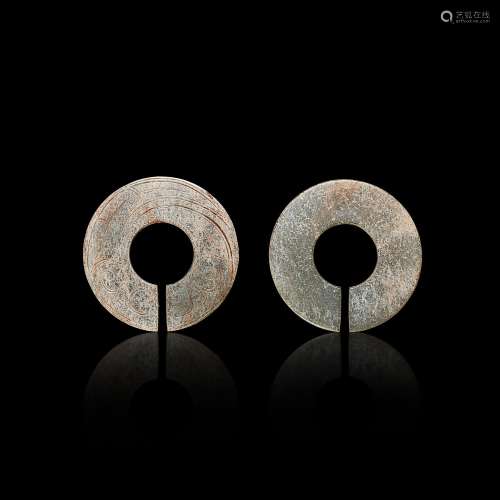 Two pale celadon jade slit rings, jue, Eastern Zhou dynasty ...