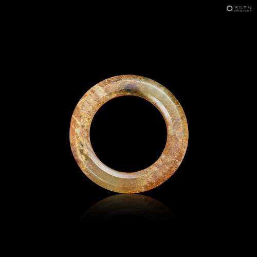An archaic celadon jade ring, yuan, Zhou dynasty or later 周...
