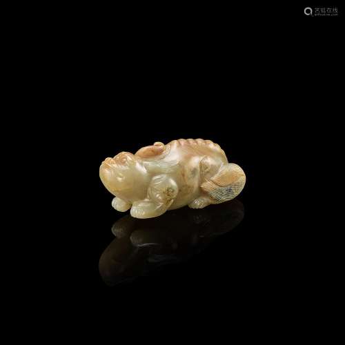 A celadon jade recumbent mythical animal, Ming dynasty 明 青...