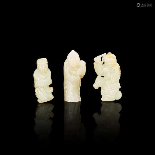 A group of three pale celadon jade standing figures, 17th - ...