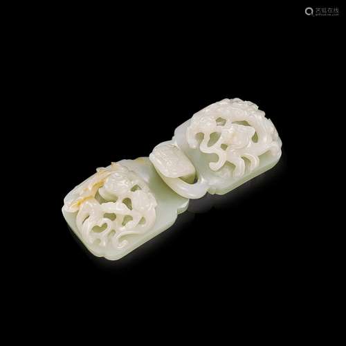 A pale celadon jade 'chilong and lingzhi' belt buckl...