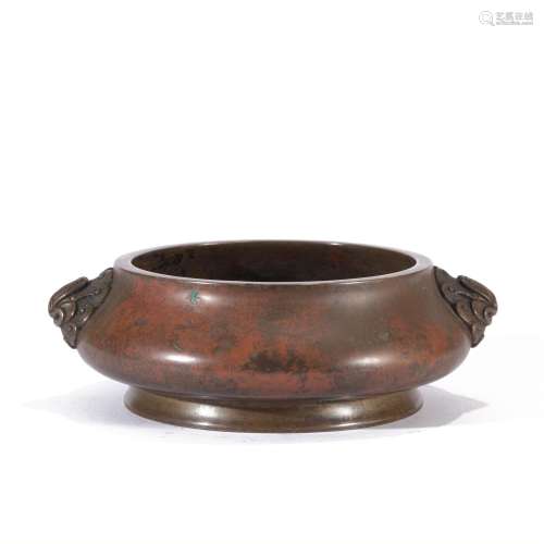 A BRONZE ROUNDED CENSER WITH DOUBLE HANDLES