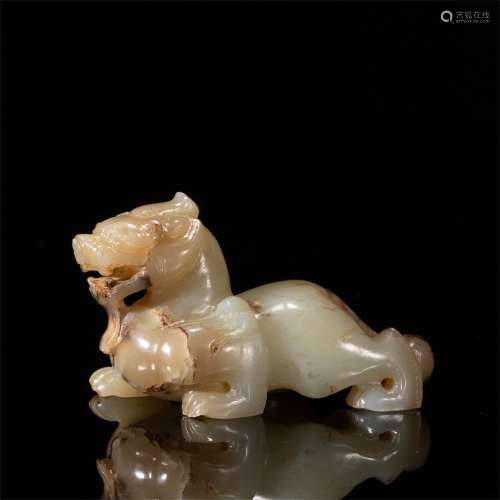 A CARVED JADE MTYHICAL BEAST