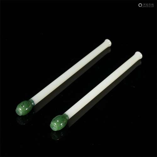 A PAIR OF CARVED WHITE AND SPINACH GREEN JADE BRUSH HOULDERS