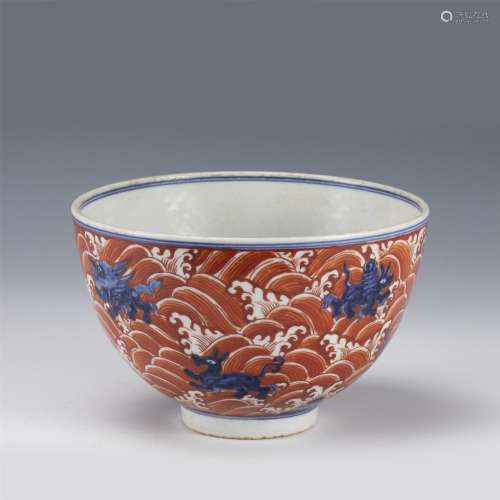 A CHINESE UNDERGLAZE BLUE AND IRON RED BEASTS BOWL
