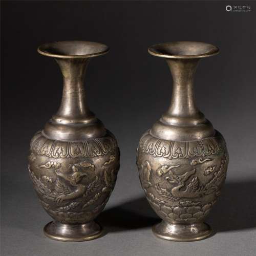 A PAIR OF SILVER PHOENIX VASES