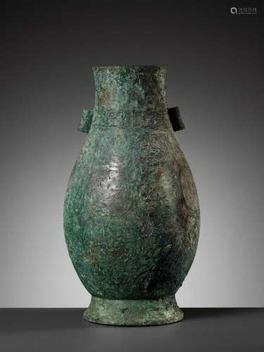 A RARE ARCHAIC BRONZE RITUAL WINE VESSEL, HU, MIDDLE WESTERN...