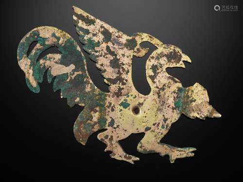 A GILT COPPER ALLOY ‘PHOENIX’ REPOUSSÉ ORNAMENT, WARRING STA...