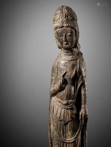 A RARE AND IMPORTANT LIMESTONE FIGURE OF A BODHISATTVA, LONG...