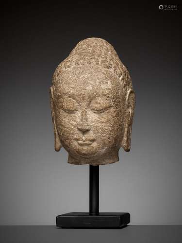 A FINE LIMESTONE HEAD OF BUDDHA, NORTHERN QI DYNASTY