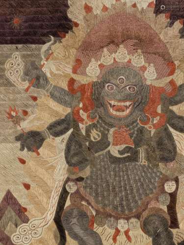 AN IMPRESSIVE SILK EMBROIDERED THANGKA OF MAHAKALA