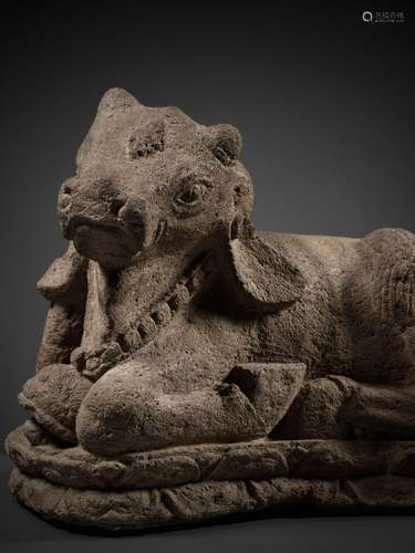 A MAJAPAHIT VOLCANIC STONE FIGURE OF NANDI, JAVA, 13TH - 15T...