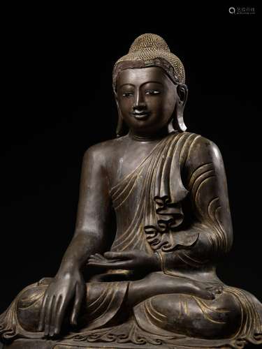 A MONUMENTAL LACQUER-GILT BRONZE STATUE OF BUDDHA SHAKYAMUNI...