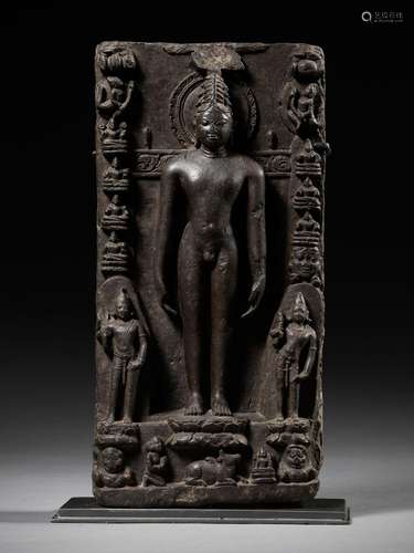 A BLACK STONE STELE DEPICTING RISHABHANATHA, THE FIRST TIRTH...