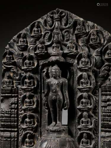 A BLACK STONE STELE OF NEMINATHA, THE 22ND JAIN TIRTHANKARA