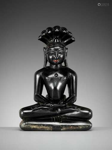 A BLACK STONE FIGURE OF PARSHVANATHA, JAIN, 15TH-17TH CENTUR...