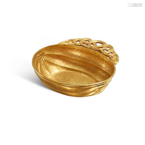 <br />
A gold melon-shaped 'peony' ear cup, 12th - 13th cent...