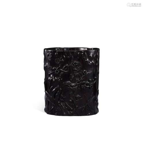 <br />
A carved zitan 'prunus and bamboo' brushpot, Qing dyn...