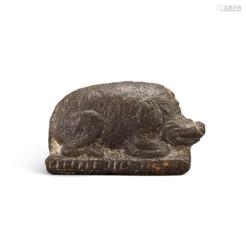 <br />
A carved stone figure of a recumbent boar, Tang dynas...