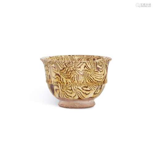 <br />
A yellow-glazed marbled cup, Tang dynasty 唐 黃釉絞胎...