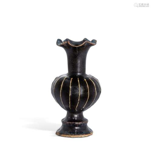 <br />
A Cizhou black-glazed ribbed floriform lobed vase, So...