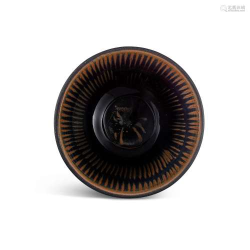 <br />
A Cizhou black-glazed russet-striped bowl, Jin dynast...