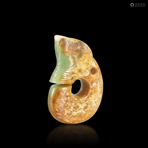 <br />
A celadon and russet jade pig-dragon, Neolithic perio...